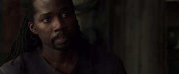 Movie still from “The Matrix Reloaded” (2003), directed by Lana Wachowski – A person wearing a sweater; Close Up shot, Over the shoulder angle