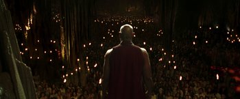 Movie still from “The Matrix Reloaded” (2003), directed by Lana Wachowski – A crowd of people are gathered in a dark room; Wide shot, High angle