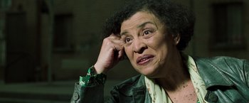 Movie still from “The Matrix Reloaded” (2003), directed by Lana Wachowski – An older woman is looking at the camera; Close Up shot, Low angle