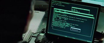 Movie still from “The Matrix Reloaded” (2003), directed by Lana Wachowski – A computer screen that has a lot of information on it; Close Up shot, Over the shoulder angle