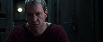 Movie still from “The Matrix Reloaded” (2003), directed by Lana Wachowski – A person wearing a sweater; Close Up shot, Low angle