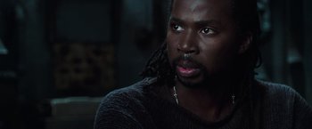 Movie still from “The Matrix Reloaded” (2003), directed by Lana Wachowski – A person with long dreadlocks; Close Up shot, High angle