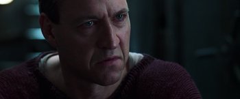 Movie still from “The Matrix Reloaded” (2003), directed by Lana Wachowski – A person looking at the camera; Close Up shot, Low angle