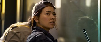 Movie still from “The Matrix Resurrections” (2021), directed by Lana Wachowski – A person wearing a hat; Close Up shot, Low angle