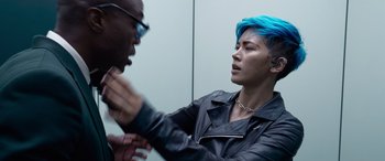 Movie still from “The Matrix Resurrections” (2021), directed by Lana Wachowski – A man with blue hair and a man with black hair; Medium shot, Over the shoulder angle