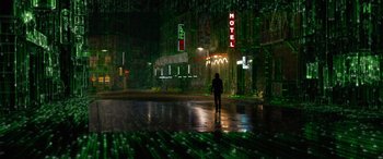 Movie still from “The Matrix Resurrections” (2021), directed by Lana Wachowski – A person is standing in the middle of the street; Extreme Wide shot, Low angle