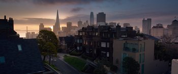 Movie still from “The Matrix Resurrections” (2021), directed by Lana Wachowski – A view of a city skyline at sunset; Extreme Wide shot, High angle