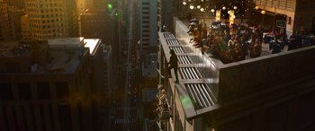 Movie still from “The Matrix Resurrections” (2021), directed by Lana Wachowski – A man standing on the side of a tall building; Extreme Wide shot, High angle
