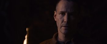 Movie still from “The Matrix Resurrections” (2021), directed by Lana Wachowski – A person wearing a sweater; Close Up shot, Over the shoulder angle