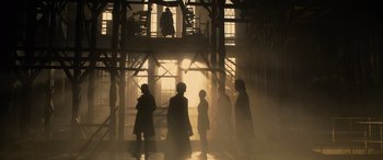 Movie still from “The Matrix Resurrections” (2021), directed by Lana Wachowski – A group of people standing in the middle of a building; Extreme Wide shot, Low angle