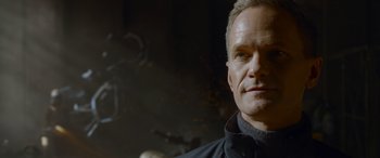 Movie still from “The Matrix Resurrections” (2021), directed by Lana Wachowski – A man that is looking at the camera; Close Up shot, Low angle