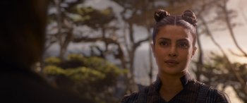 Movie still from “The Matrix Resurrections” (2021), directed by Lana Wachowski – A person with a bun on their head; Close Up shot, Over the shoulder angle