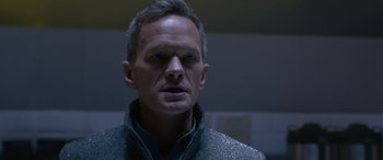 Movie still from “The Matrix Resurrections” (2021), directed by Lana Wachowski – A person wearing a jacket; Close Up shot, Over the shoulder angle