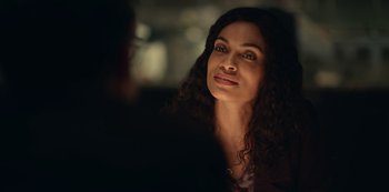 Movie still from “Dopesick” (2021), directed by Danny Strong – A person sitting in a room; Close Up shot, Over the shoulder angle