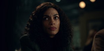 Movie still from “Dopesick” (2021), directed by Danny Strong – A person with long curly hair; Close Up shot, Low angle