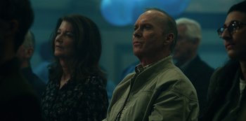 Movie still from “Dopesick” (2021), directed by Danny Strong – A man and a woman are looking up at something; Close Up shot, Low angle