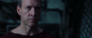 Movie still from “The Matrix Revolutions” (2003), directed by Lilly Wachowski – A person wearing a sweater; Close Up shot, Low angle