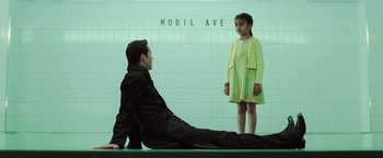 Movie still from “The Matrix Revolutions” (2003), directed by Lilly Wachowski – A man and a little girl standing next to each other; Wide shot, High angle