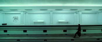 Movie still from “The Matrix Revolutions” (2003), directed by Lilly Wachowski – Two benches are shown in a room; Extreme Wide shot, High angle