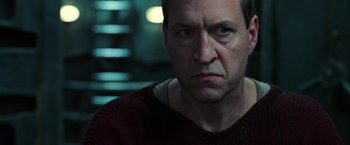 Movie still from “The Matrix Revolutions” (2003), directed by Lilly Wachowski – A person wearing a red shirt; Close Up shot, Low angle