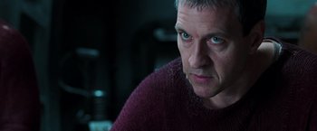 Movie still from “The Matrix Revolutions” (2003), directed by Lilly Wachowski – A person wearing a sweater; Close Up shot, Low angle