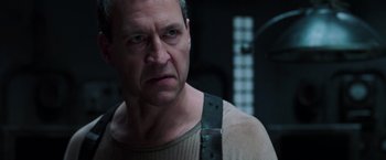 Movie still from “The Matrix Revolutions” (2003), directed by Lilly Wachowski – A person wearing a shirt; Close Up shot, Low angle