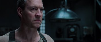 Movie still from “The Matrix Revolutions” (2003), directed by Lilly Wachowski – A person wearing a uniform; Close Up shot, Low angle