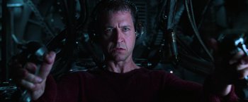 Movie still from “The Matrix Revolutions” (2003), directed by Lilly Wachowski – A person wearing headphones; Close Up shot, Low angle