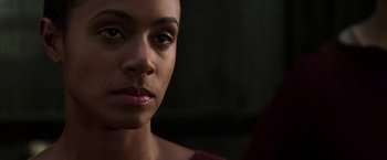 Movie still from “The Matrix Revolutions” (2003), directed by Lilly Wachowski – A woman's face in the dark; Close Up shot, Over the shoulder angle