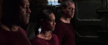 Movie still from “The Matrix Revolutions” (2003), directed by Lilly Wachowski – A man and a woman standing next to each other; Medium shot, Low angle