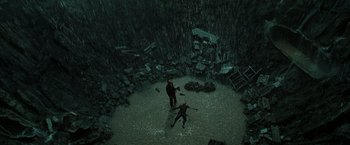 Movie still from “The Matrix Revolutions” (2003), directed by Lilly Wachowski – Two people standing in the middle of a flooded area; Extreme Wide shot, Overhead angle