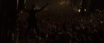 Movie still from “The Matrix Revolutions” (2003), directed by Lilly Wachowski – A large crowd of people in a dark room; Extreme Wide shot, High angle