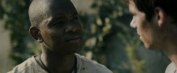 Movie still from “The Maze Runner” (2014), directed by Wes Ball – A person looking up at the sky; Close Up shot, Over the shoulder angle