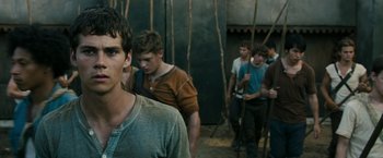 Movie still from “The Maze Runner” (2014), directed by Wes Ball – A group of young men standing next to each other; Medium shot, Low angle