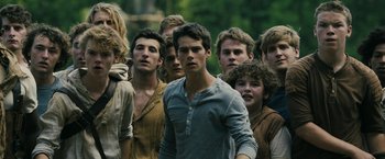 Movie still from “The Maze Runner” (2014), directed by Wes Ball – A group of young men standing next to each other; Medium shot, High angle