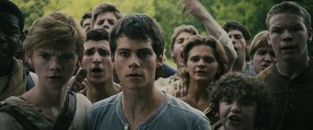 Movie still from “The Maze Runner” (2014), directed by Wes Ball – A group of young men standing next to each other; Close Up shot, Over the shoulder angle