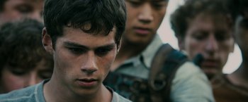Movie still from “The Maze Runner” (2014), directed by Wes Ball – Two young men standing next to each other; Close Up shot, Over the shoulder angle