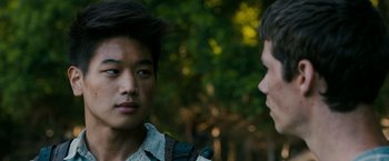 Movie still from “The Maze Runner” (2014), directed by Wes Ball – Two young men are standing in front of each other; Close Up shot, Over the shoulder angle