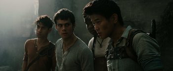 Movie still from “The Maze Runner” (2014), directed by Wes Ball – A group of young men standing next to each other; Close Up shot, Low angle