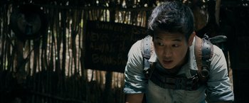 Movie still from “The Maze Runner” (2014), directed by Wes Ball – A young man wearing a harness is looking at the camera; Close Up shot, Low angle