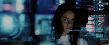 Movie still from “The Maze Runner” (2014), directed by Wes Ball – A woman is looking at a computer screen; Close Up shot, Low angle