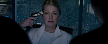 Movie still from “The Maze Runner” (2014), directed by Wes Ball – A woman holding a gun up to her head; Close Up shot, High angle