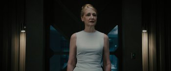 Movie still from “The Maze Runner” (2014), directed by Wes Ball – A woman in a white dress standing in front of a window; Close Up shot, Low angle