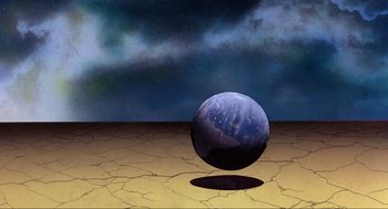 Movie still from “The Meaning of Life” (1983), directed by Terry Jones – An image of an image of a ball on the ground; Extreme Wide shot, Low angle