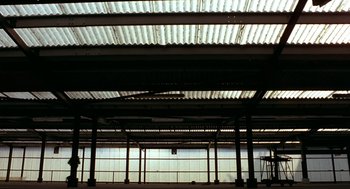 An empty warehouse with a lot of windows