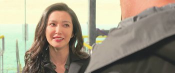 Movie still from “The Meg” (2018), directed by Jon Turteltaub – A person with long black hair; Close Up shot, Over the shoulder angle