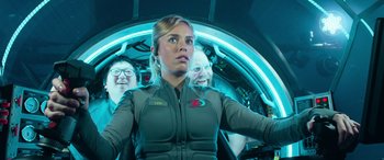 Movie still from “The Meg” (2018), directed by Jon Turteltaub – A group of people sitting in a space ship; Medium shot, Over the shoulder angle