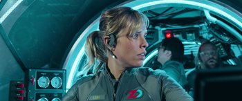 Movie still from “The Meg” (2018), directed by Jon Turteltaub – A woman in a space suit with a headset on; Close Up shot, Over the shoulder angle