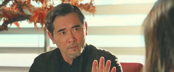 Movie still from “The Meg” (2018), directed by Jon Turteltaub – A person wearing a jacket; Close Up shot, Over the shoulder angle