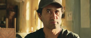 Movie still from “The Meg” (2018), directed by Jon Turteltaub – A person wearing a hat; Close Up shot, Low angle